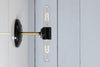 Double Bulb Brass and Black Wall Sconce Light
